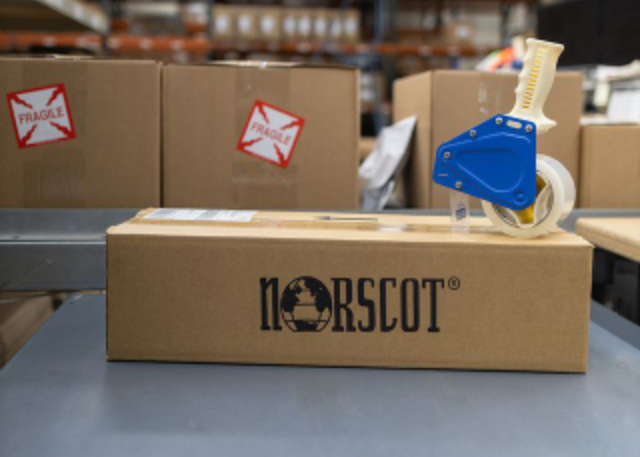 A package containing a Norscot corporate kitting project